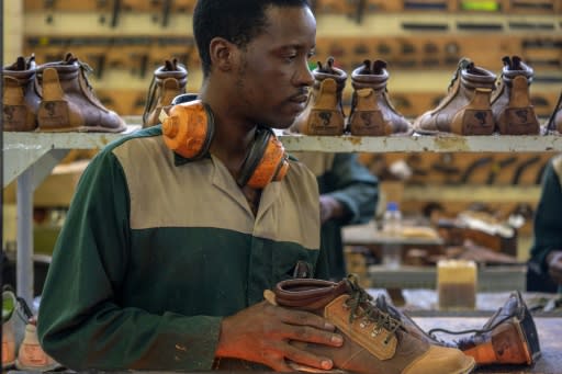 Orders are piling in and new workers are being recruited at the Courteney boot company -- that seems to defy all the odds as Zimbabwe is battered by decades of economic misery