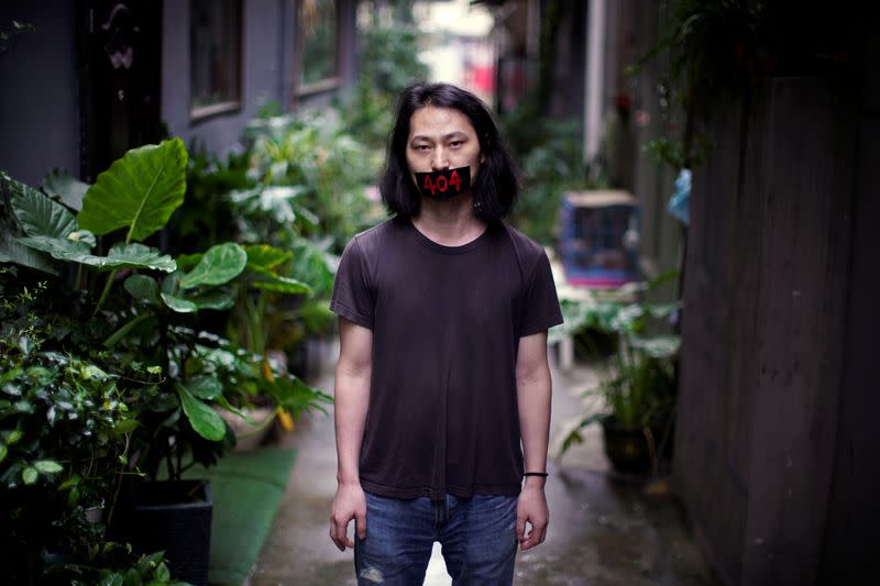 Brother Nut, Chinese performance artist, poses for a picture in Shanghai