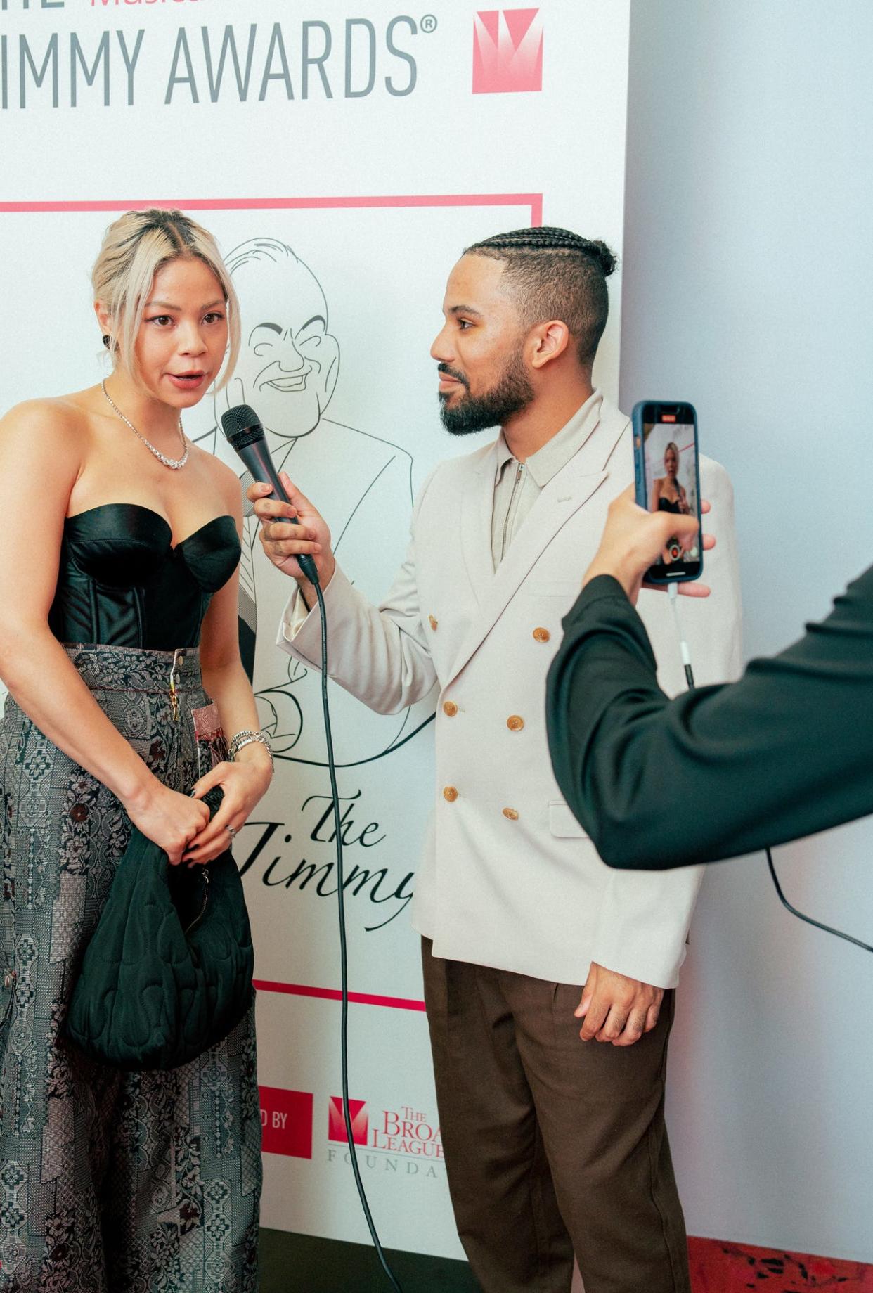 JD Davis of Lakeland interviews actor Eva Noblezada on the red carpet at the Jimmy Awards in New York on Monday. Davis, a recent graduate of Harrison School for the Arts, was one of two student reporters selected to cover the event.