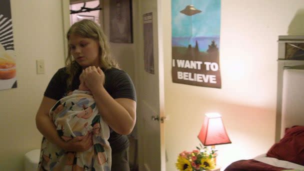 PHOTO: Brooke Alexander, 19, cradles her infant daughter in her home. (ABC News)