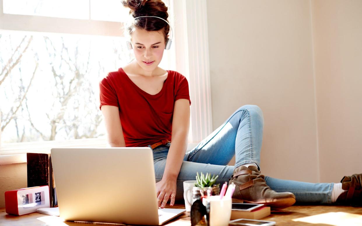 A teen on her laptop - E+