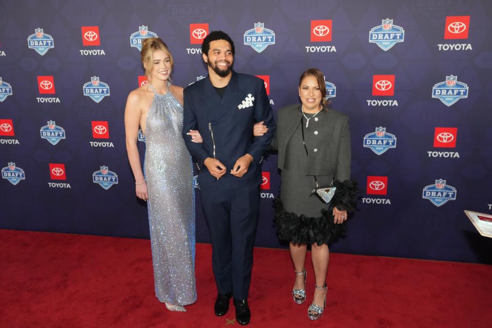 Southern California Trojans quarterback Caleb Williams stands on the red carpet ahead of the 2024 NFL Draft at Detroit’s Fox Theatre.