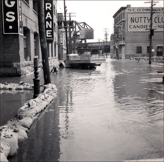 <b>1950 flooding of the Red River (Winnipeg, Manitoba)</b> <br> <b>Financial cost:</b> $600 million <br><br> The Canadian Army and Red Cross helped evacuate 100,000 Winnipeg residents -- a third of the city's population -- when the Red River flooded parts of southern Manitoba starting in late April. Eight dikes gave way, and four of 11 bridges were destroyed. The river stayed above flood stage for 51 days. A combination of heavy snows during the previous winter and heavy spring rains caused the destruction of 10,000 homes. <br> <br> Image: Winnipeg's Lombard Avenue