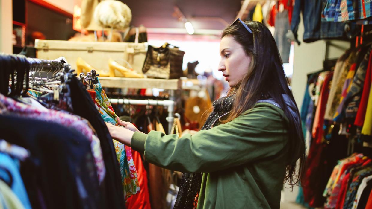  Woman shopping in London second hand marketplace 