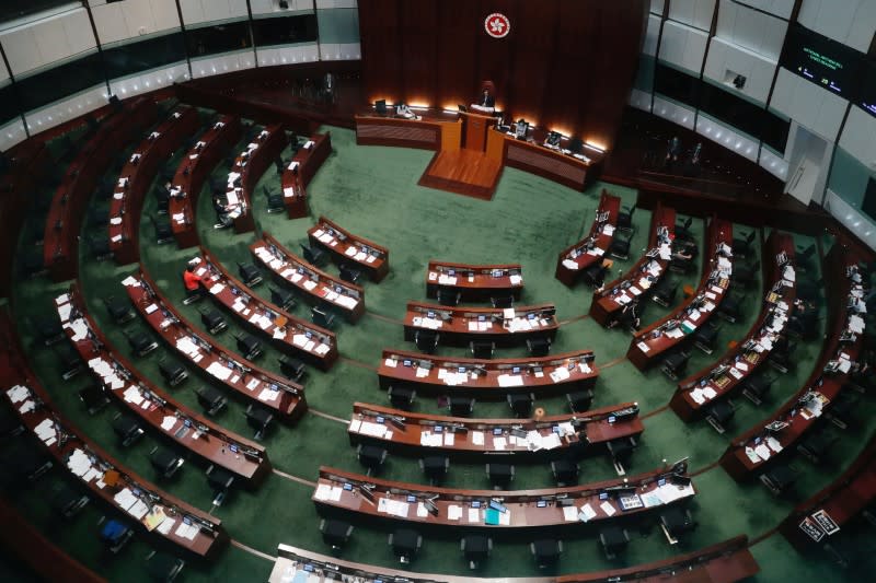 Hong Kong's Legislative Council attend a council meeting to discuss the controversial national anthem bill in Hong Kong
