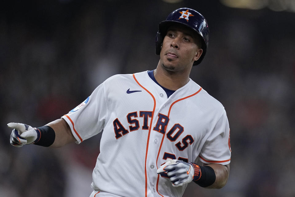 Houston Astros' Michael Brantley celebrates his two-run home run against the New York Yankees during the second inning of a baseball game Saturday, Sept. 2, 2023, in Houston. (AP Photo/Kevin M. Cox)