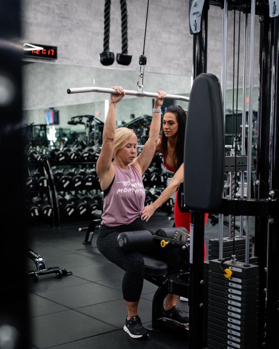 a couple of women lifting weights