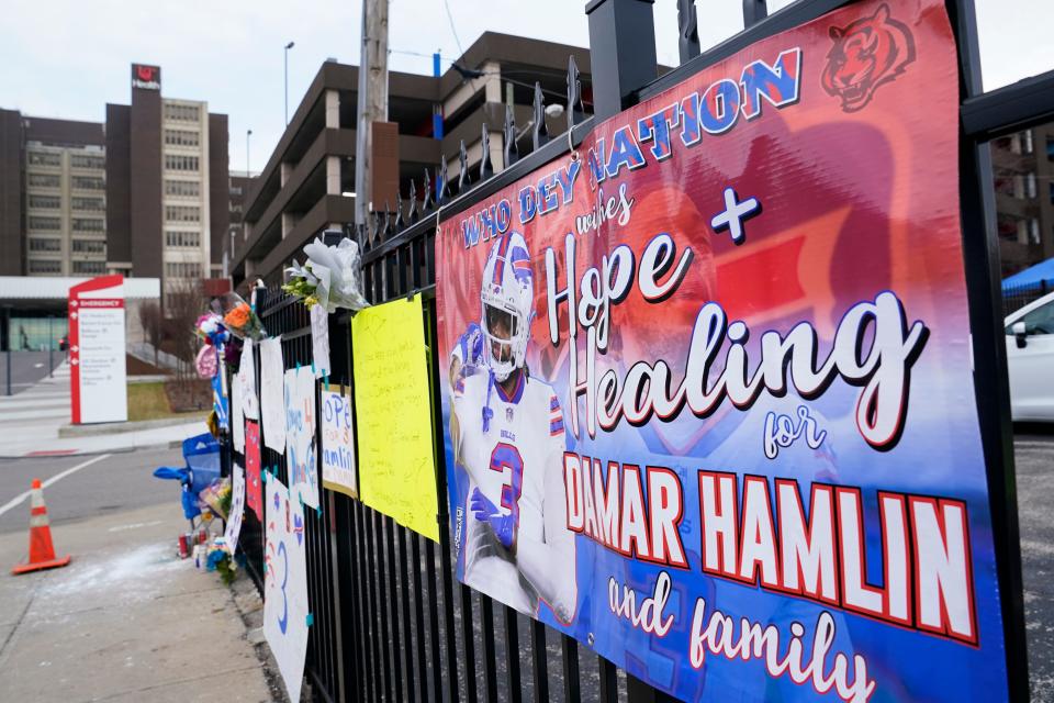A sign hangs on fence outside the University of Cincinnati Medical Center where Buffalo Bills safety Damar Hamiln remains hospitalized.
