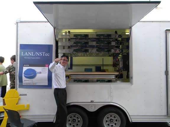 Haruo Miyardera, lead author of the new Los Alamos National Laboratory paper who is currently working at Toshiba Corporation, in front of a Mini Muon Tracker device.