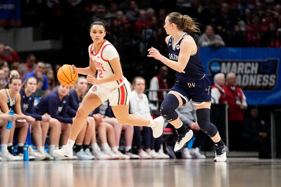 Mar 22, 2024; Columbus, OH, USA; Ohio State Buckeyes guard Celeste Taylor (12) dribbles up court past Maine Black Bears guard Anne Simon (3) during the second half of the women’s basketball NCAA Tournament first round game at Value City Arena. Ohio State won 80-57.