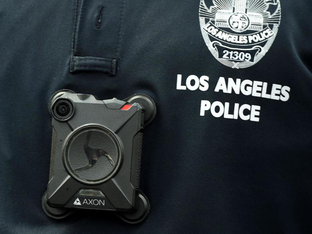 An LAPD officer wears a body camera: AFP via Getty Images