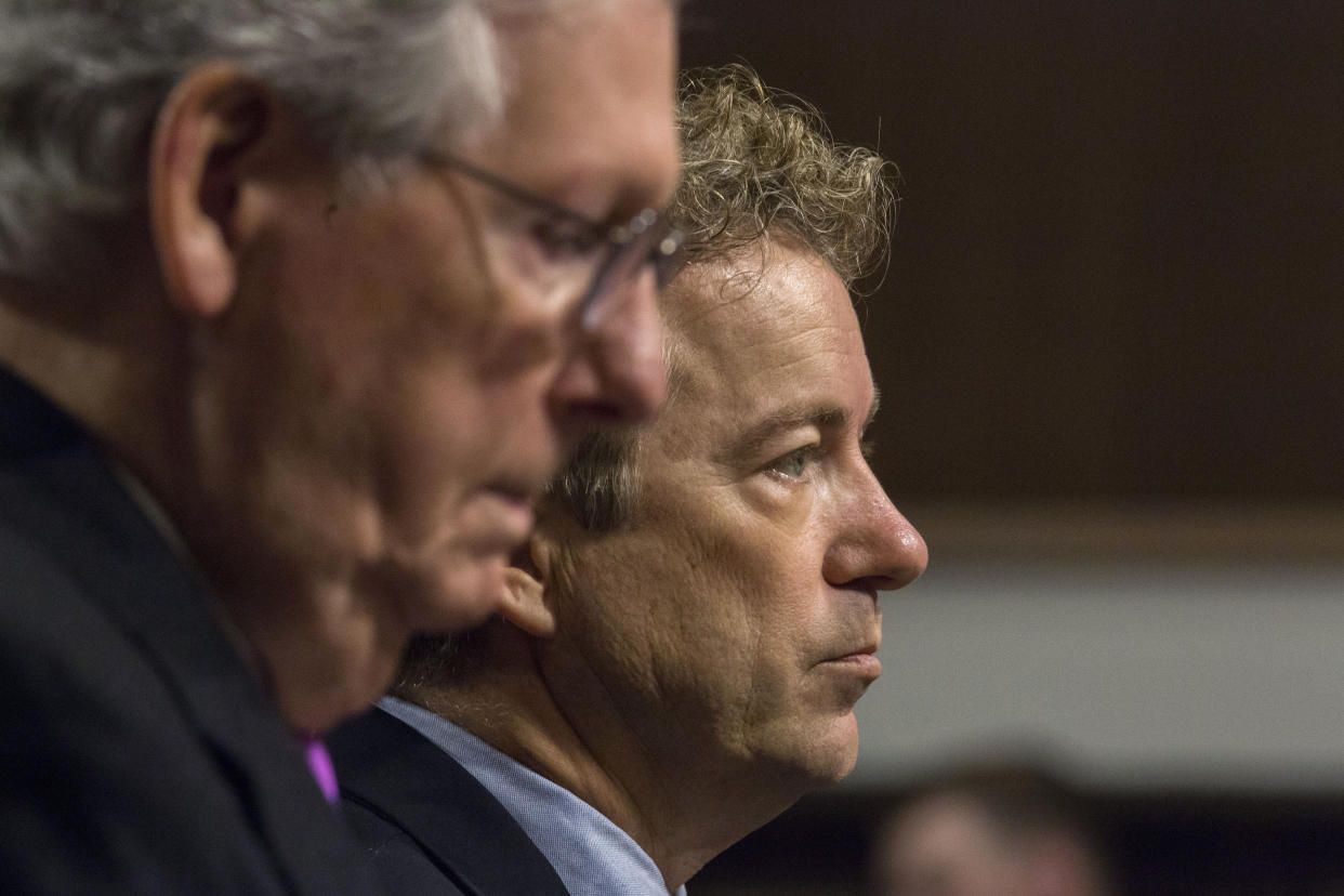 U.S. GOP Senators Mitch McConnell, left, and Rand Paul appear on Capitol Hill in Washington. (AP Photo/Zach Gibson)