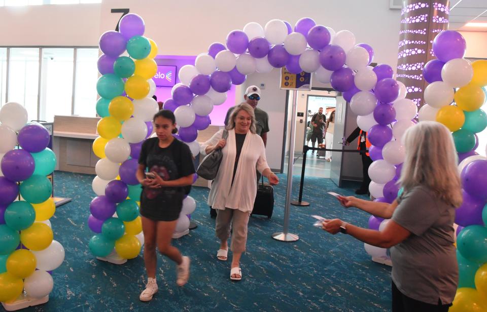 A colorful balloon archway greeted passengers aboard Avelo's June 21 inaugural flight into Melbourne Orlando International Airport from New Haven, Connecticut.