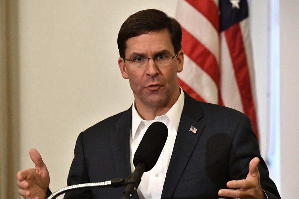 FILE - In this Friday, Oct. 4, 2019 file photo, Defense Secretary Mark Esper speaks to a gathering of soldiers at the University Club at the University of Louisville in Louisville, Ky. Esper says during a weekend trip to the Middle East that under the current plan all U.S. troops leaving Syria will go to western Iraq, and that the military will continue to conduct operations against the Islamic State group to prevent a resurgence in that country. As Esper left Washington on Saturday, Oct. 19, U.S. troops were continuing to pull out of northern Syria after Turkey's invasion into the border region. (AP Photo/Timothy D. Easley, File)