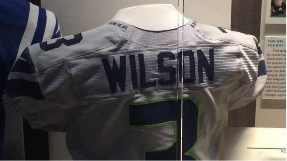 Russell Wilson’s jersey he wore in the Seahawks’ win over Buffalo in Toronto on Dec. 16, 2012. In that game he became the first NFL player to rush for three touchdowns and throw for another in the first half of a game. The jersey is on display on the second floor of the Pro Football Hall of Fame in Canton, Ohio.