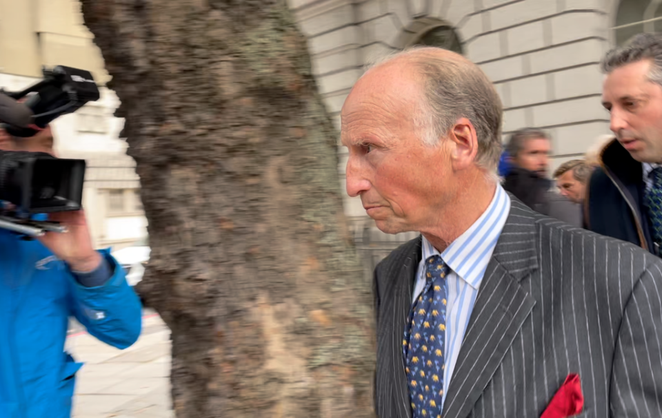 Mark Hankinson leaves Westminster Magistrates’ Court with supporters as hunt saboteurs cheer (Laura Parnaby/PA).