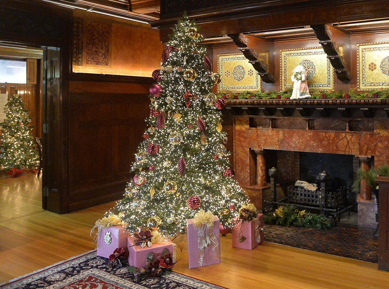 Holiday decorations are shown near the main fireplace in the Watson-Curtze Mansion during a previous Victorian Holidays.