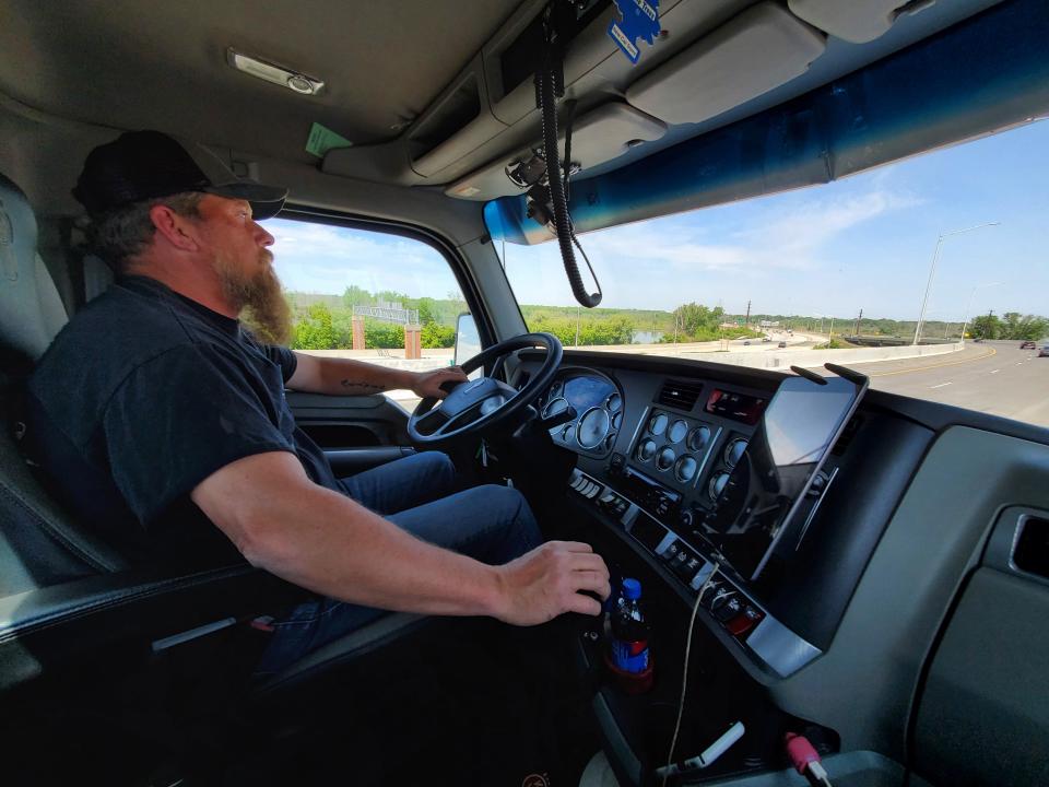 Justin Babik drives a log truck in northeastern Wisconsin on June 9, 2023. When Babik drives through Green Bay, he has to watch for other drivers cutting him off and pedestrians walking into traffic.
