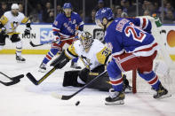 Pittsburgh Penguins goaltender Tristan Jarry defends against New York Rangers left wing Chris Kreider during the second period in Game 7 of an NHL hockey Stanley Cup first-round playoff series Sunday, May 15, 2022, in New York. (AP Photo/Adam Hunger)