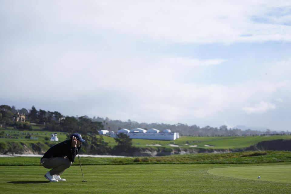 Thomas Detry lines his putt hits on the 17th green at Pebble Beach Golf Links during the second round of the AT&T Pebble Beach National Pro-Am golf tournament in Pebble Beach, Calif., Friday, Feb. 2, 2024. (AP Photo/Ryan Sun)