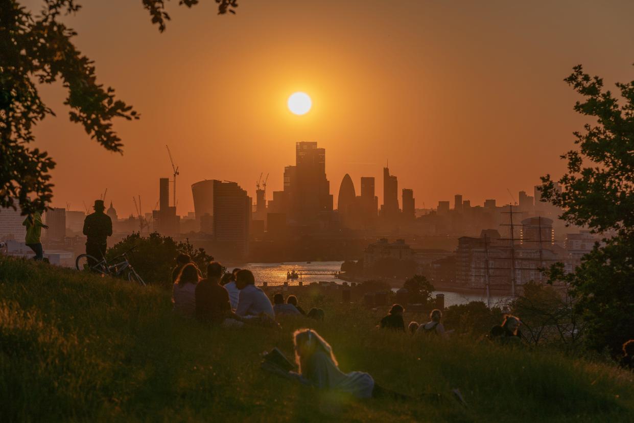 London, UK. 13th June, 2023. UK Weather: Dramatic sunset over Greenwich Park.  Temperatures have soared in recent days, peaking 32.2C on Saturday 10 June, the highest recorded so far this year. A heatwave is defined as three consecutive days with daily maximum temperatures meeting or exceeding the heatwave temperature threshold, according to the Met Office. Credit: Guy Corbishley/Alamy Live News