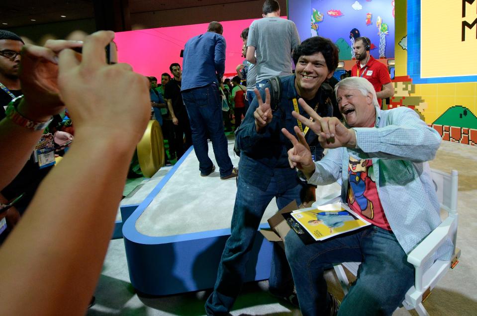 Charles Martinet poses for a photos in 2015 with a fan during the opening day of e3, the Electronic Entertainment Expo.