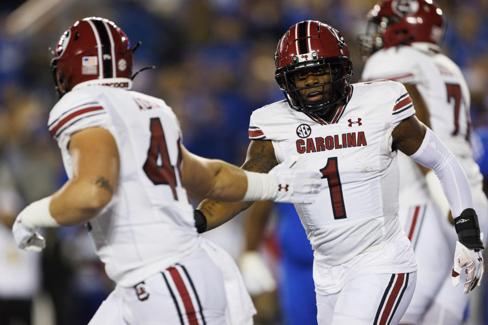 South Carolina running back MarShawn Lloyd (1) celebrates with tight end Nate Adkins (44) after Lloyd's touchdown against Kentucky during the first half of an NCAA college football game in Lexington, Ky., Saturday, Oct. 8, 2022. (AP Photo/Michael Clubb)