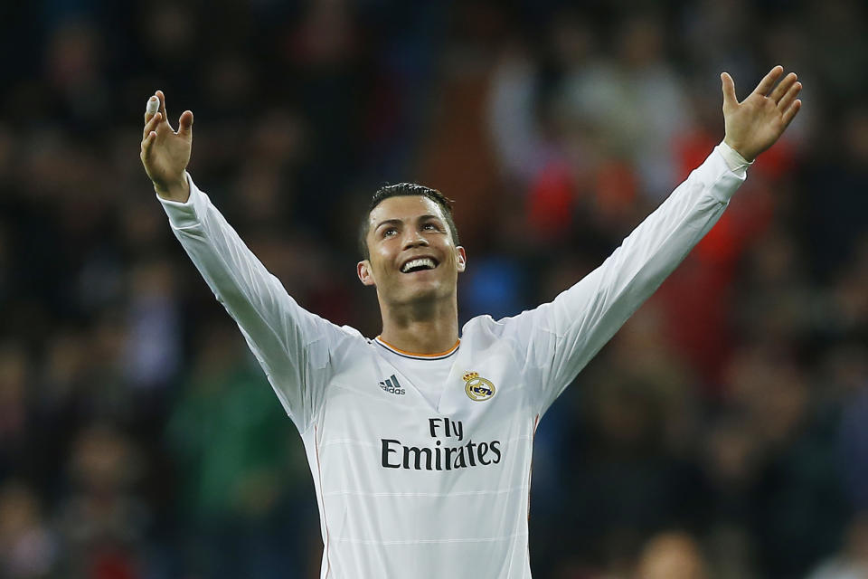 Real's Cristiano Ronaldo celebrates his second goal during a Spanish La Liga soccer match between Real Madrid and Osasuna at the Santiago Bernabeu stadium in Madrid, Spain, Saturday, April 26, 2014. (AP Photo/Andres Kudacki)