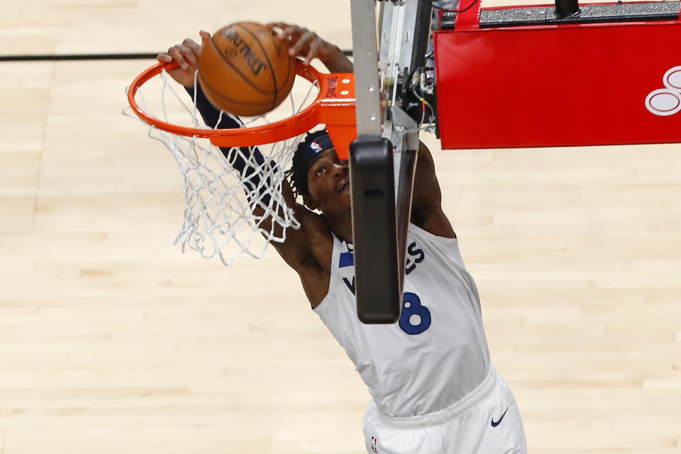 Minnesota Timberwolves forward Jarred Vanderbilt (8) dunks in the first half of an NBA basketball game against the Atlanta Hawks on Monday, Jan. 18, 2021, in Atlanta. (AP Photo/Todd Kirkland)