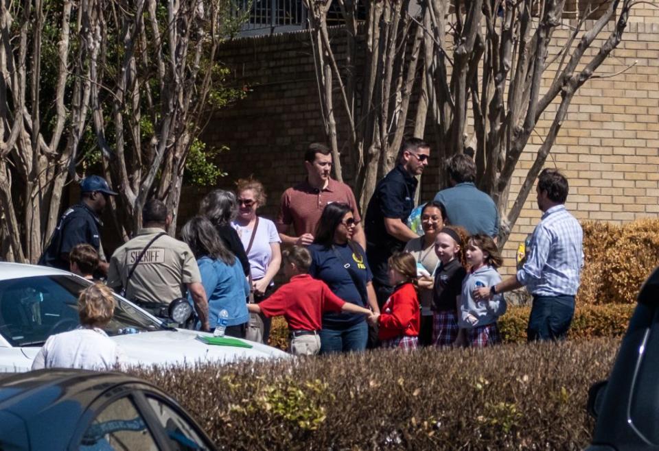 NASHVILLE, TN - MARCH 27: Children arrive at Woodmont Baptist Church to be reunited with their families after a mass shooting at The Covenant School on March 27, 2023 in Nashville, Tennessee. According to initial reports, three students and three adults were killed by the shooter, a 28-year-old woman. The shooter was killed by police responding to the scene. (Photo by Seth Herald/Getty Images)