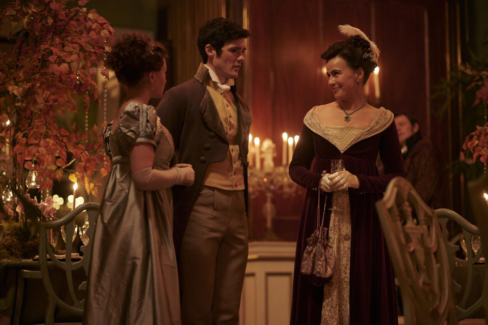 Charlotte (Rose Williams), Ralph (Cai Brigden) and Lady Susan (Sophie Winkleman) stand in conversation at Georgiana's party