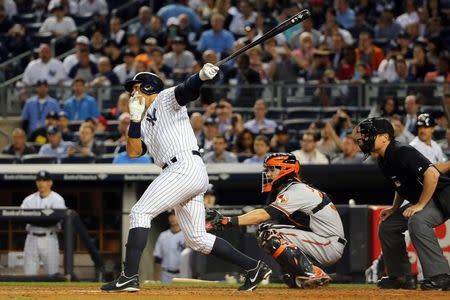 May 7, 2015; Bronx, NY, USA; New York Yankees designated hitter Alex Rodriguez (13) hits his 661 home run surpassing the record of Willie Mays during the third inning against the Baltimore Orioles at Yankee Stadium. Mandatory Credit: Anthony Gruppuso-USA TODAY Sports