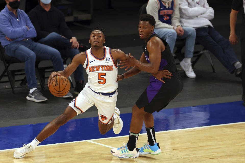 New York Knicks' Immanuel Quickley (5) attempts to get past Toronto Raptors' Kyle Lowry, right, who defends during an NBA basketball game at Madison Square Garden, Sunday, April 11, 2021, in New York. (Rich Schultz/Pool Photo via AP)