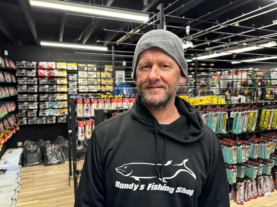 Windsor-Essex fishing guide, bait company owner, and fishing gear store owner Jon Bondy inside his business on County Road 17 in Maidstone.