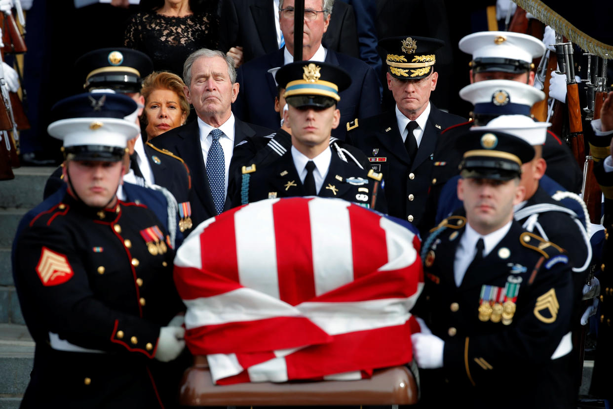 Former President George W. Bush follows a military honor guard as they carry the casket out of a state funeral for U.S. President George H.W. Bush at the Washington National Cathedral in Washington, Dec. 5, 2018. (Photo: Jonathan Ernst/Reuters)