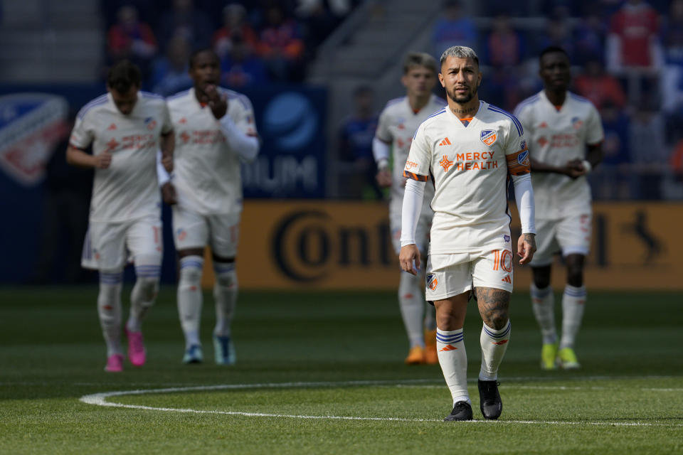 FC Cincinnati's Luciano Acosta (10) walks onto the field with teammates prior to the first half of a MLS soccer match against Toronto FC, Sunday, Feb. 25, 2024, in Cincinnati. (AP Photo/Jeff Dean)