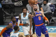 New York Knicks guard Austin Rivers (8) drives to the basket against the Charlotte Hornets in the first quarter of an NBA basketball game in Charlotte, N.C., Monday, Jan. 11, 2021. (AP Photo/Nell Redmond)