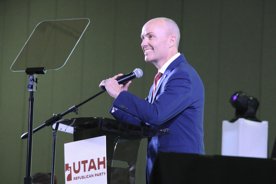 Utah Gov. Spencer Cox smiles at the crowd of nearly 4,000 Republican delegates as they greet him with loud boos at the state Republican Party Convention, Saturday, April 27, 2024, in Salt Lake City. (AP Photo/Hannah Schoenbaum)