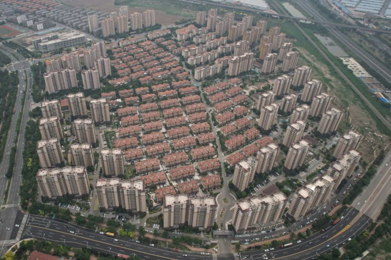 A debt crisis in China's colossal property sector is weighing on the world's number two economy (Jade GAO)