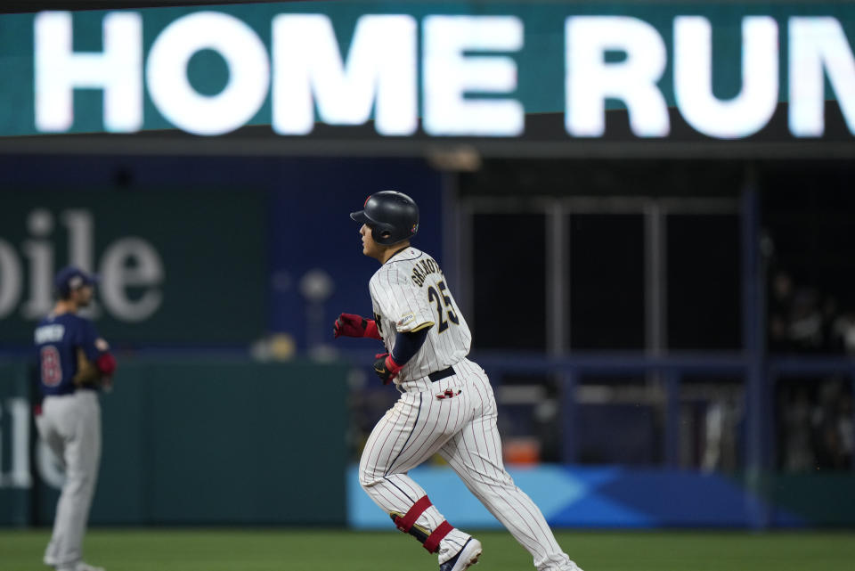 Japan's Kazuma Okamoto (25) runs bases after hitting a home run during fourth inning of a World Baseball Classic championship game, Tuesday, March 21, 2023, in Miami. (AP Photo/Wilfredo Lee)