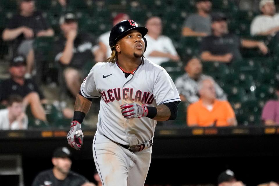 Cleveland Guardians' Jose Ramirez watches his RBI sacrifice fly during the 11th inning of the team's baseball game against the Chicago White Sox on Tuesday, Sept. 20, 2022, in Chicago. The Guardians won 10-7. (AP Photo/Charles Rex Arbogast)