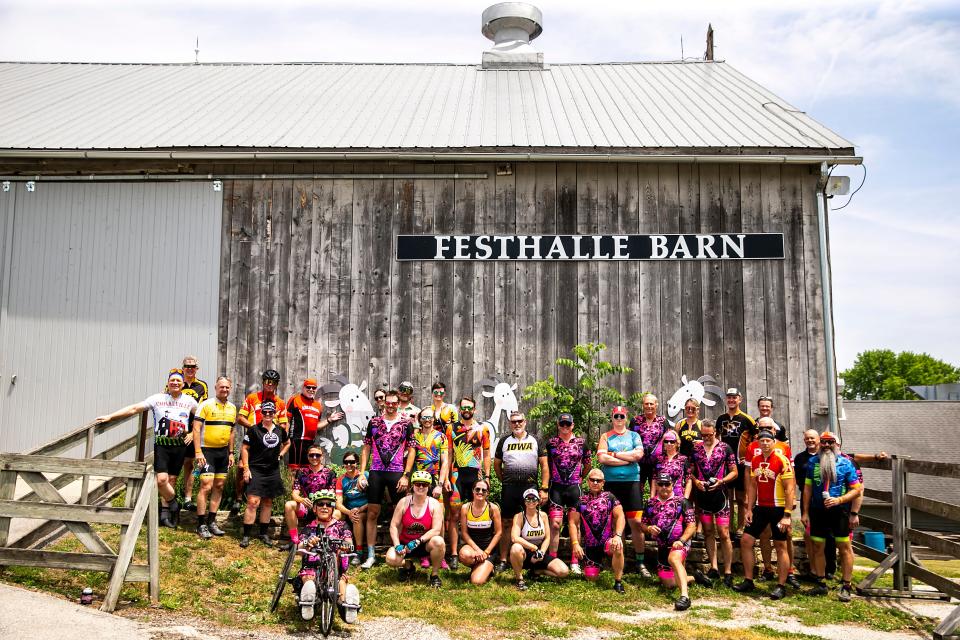 The RAGBRAI route inspection team gathers outside the Festhalle Barn in Amana on Friday.