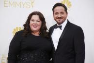 Melissa McCarthy from the CBS sitcom "Mike and Molly" and Ben Falcone arrive at the 66th Primetime Emmy Awards in Los Angeles, California August 25, 2014. REUTERS/Lucy Nicholson