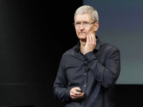 Tim Cook looking worried or sad