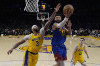 Denver Nuggets guard Jamal Murray (27) shoots against tLos Angeles Lakers forward Anthony Davis (3) during the second half of Game 3 of an NBA basketball first-round playoff series in Los Angeles, Thursday, April 25, 2024. (AP Photo/Ashley Landis)