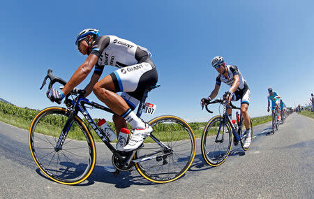 FILE PHOTO: Giant-Shimano team rider Ji Cheng of China leads the pack of riders during the 185.5-km 12th stage of the Tour de France cycling race between Bourg-en-Bresse and Saint-Etienne, France, July 17, 2014. REUTERS/Jacky Naegelen/File Photo