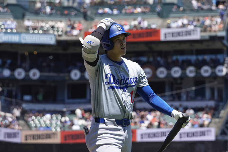 Los Angeles Dodgers' Shohei Ohtani walks to the dugout after striking out against the San Francisco Giants during the third inning of a baseball game Sunday, June 30, 2024, in San Francisco. (AP Photo/Godofredo A. Vásquez)