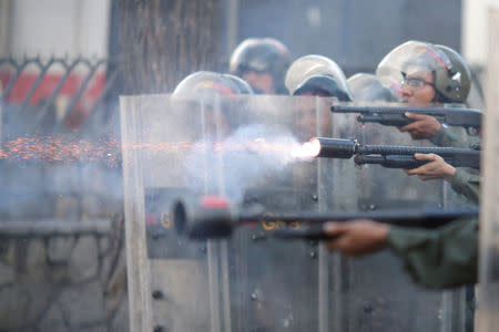 Riot security forces fire at a rally during a strike called to protest against Venezuelan President Nicolas Maduro's government in Caracas. REUTERS/Ueslei Marcelino