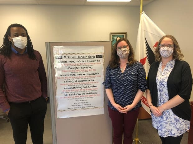 James Omowumi and Chantal Peppin developed a poster to teach the Mi'kmaw Honour Song in the language and drumming program run by the Native Council of Prince Edward Island. Katie Martin (right) runs the program.  