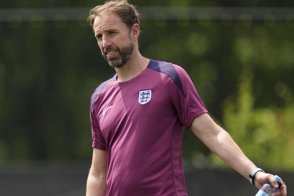 England manager Gareth Southgate during a training session at the Spa & Golf Resort Weimarer Land in Blankenhain, Germany, Saturday June 29, 2024. Gareth Southgate was credited with making England fans fall back in love with their national soccer team. Now many are turning on him. Southgate has been a largely unifying force for the national team during a period of upheaval and uncertainty in English politics and culture, but after nearly eight years and four major tournaments, the European Championship appears to signal a shift in opinion toward him. (Adam Davy/PA via AP)